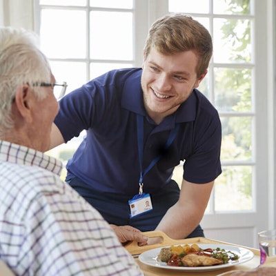 Carer and caree laughing together