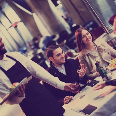 People enjoying a meal around a table