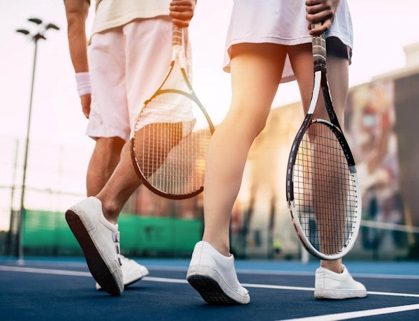 Two people playing tennis