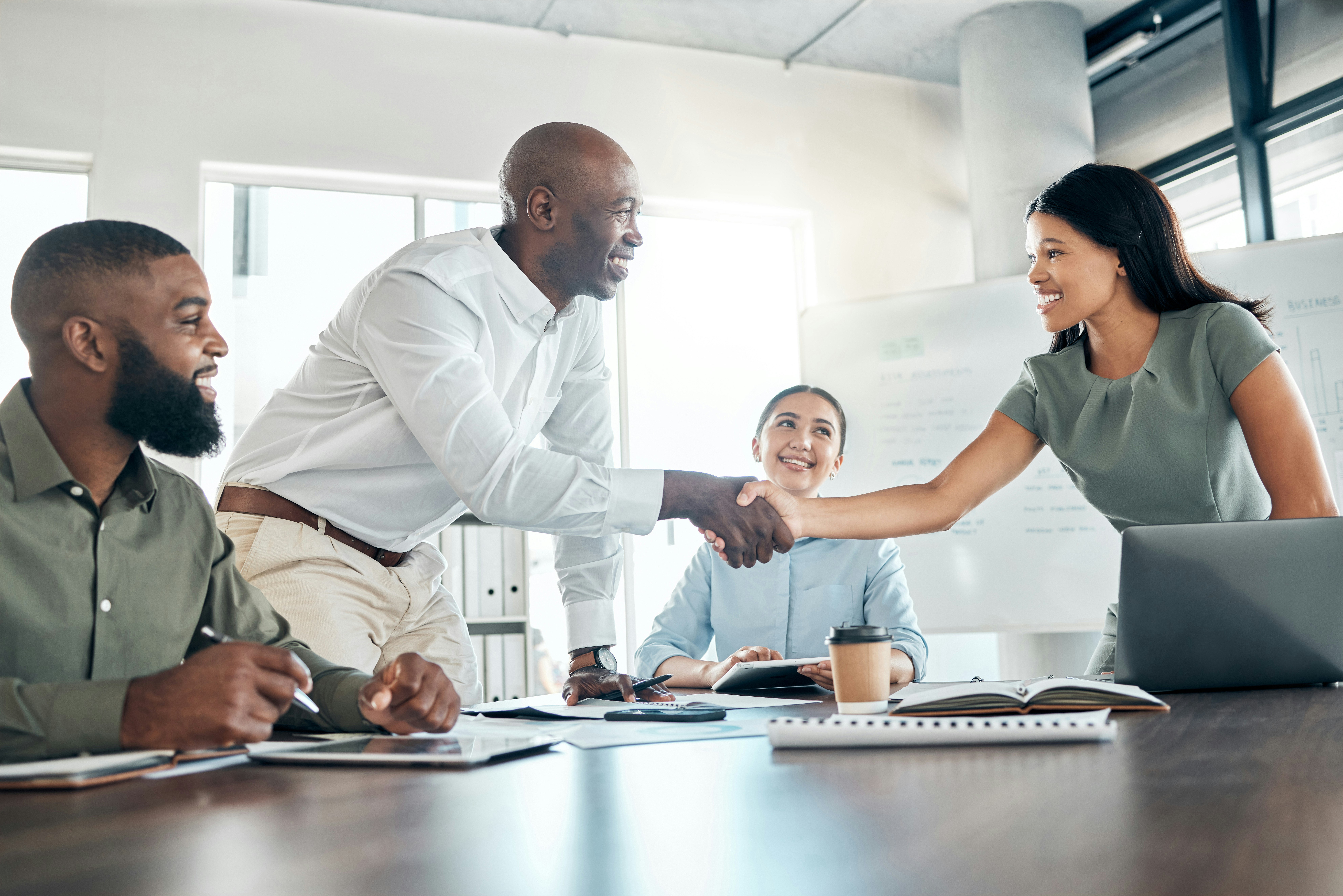 two employees shaking hands