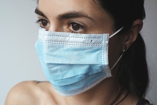 A woman wearing a mask.