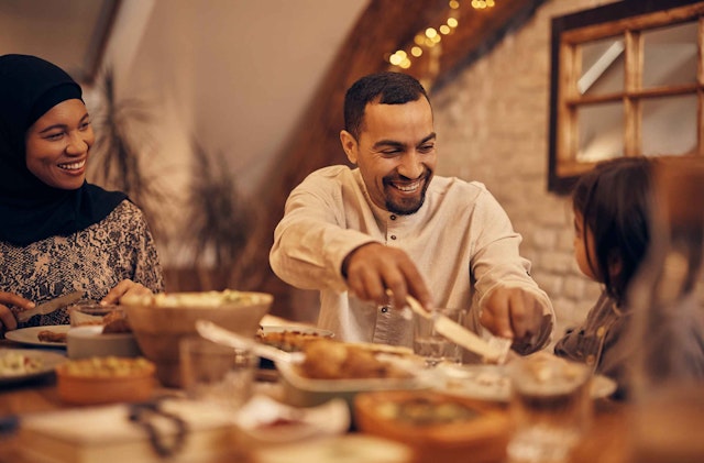 A Muslim family enjoying an iftar meal during Ramadan