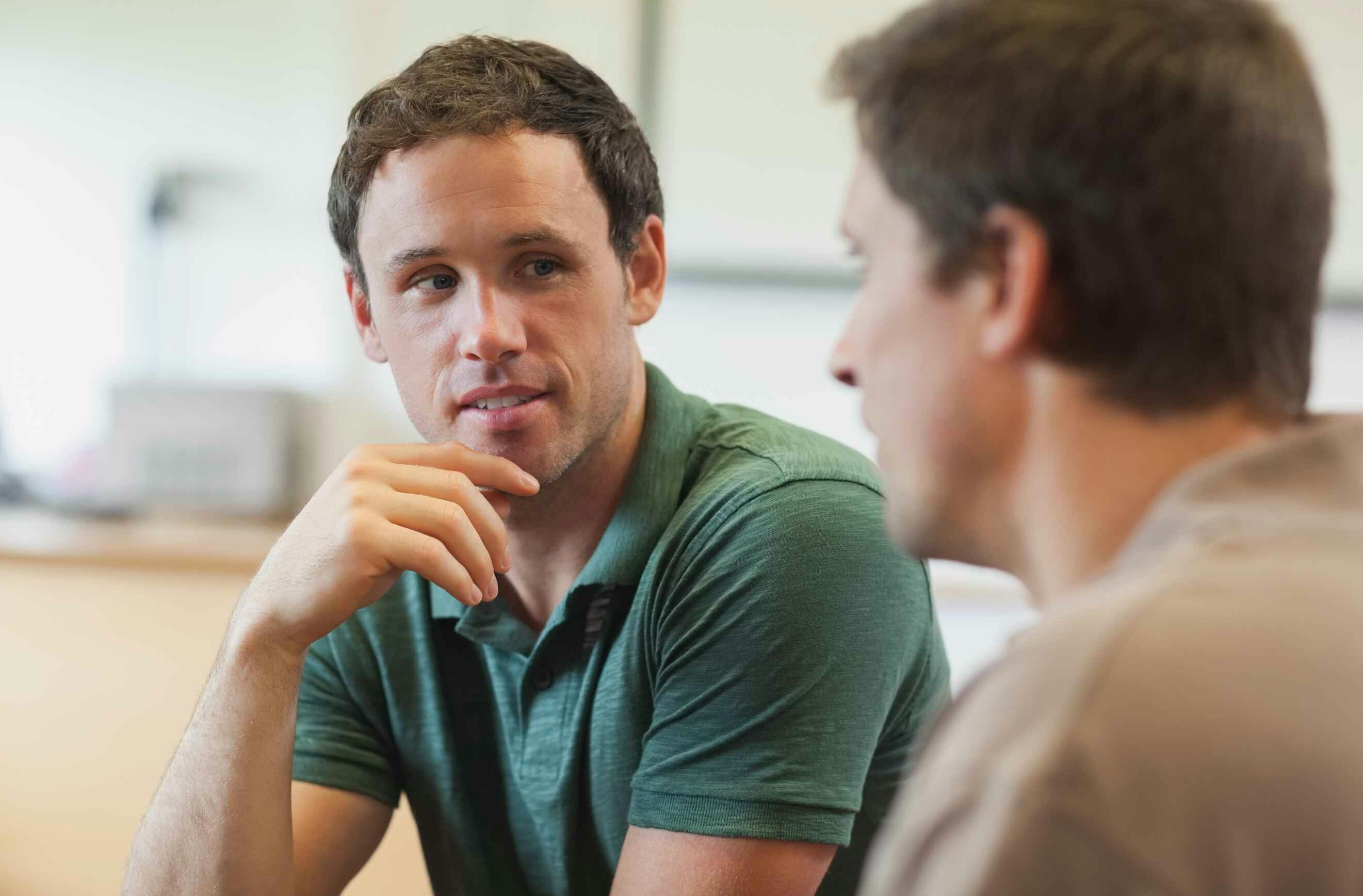 Two men sitting and talking