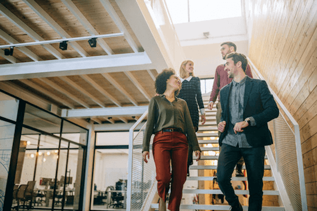 Employees walking down the stairs.