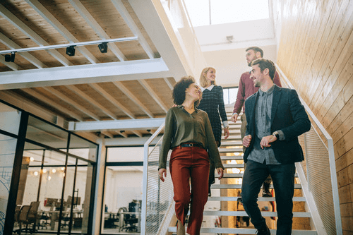 Employees walking down the stairs.