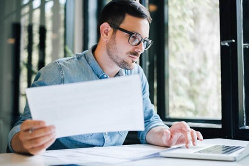 An employer looking through documents.