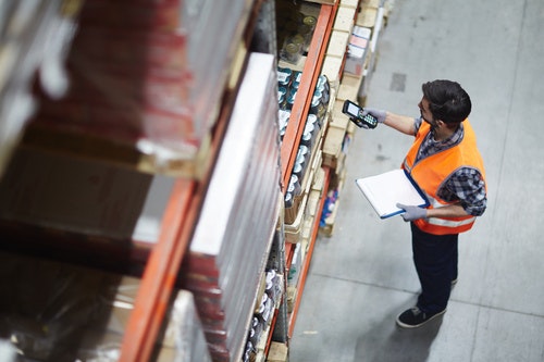 a warehouse worker checking stock