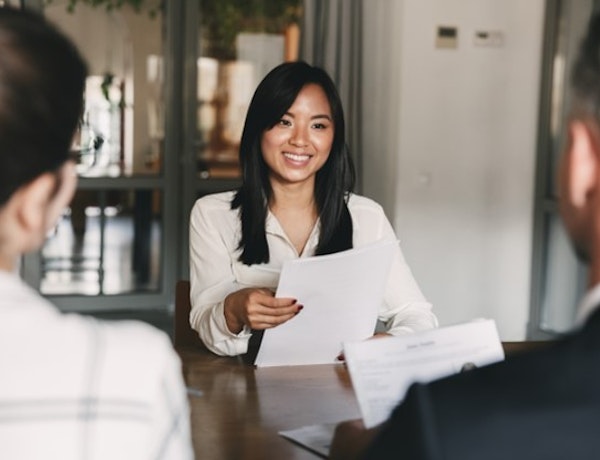 a woman having a meeting with two people