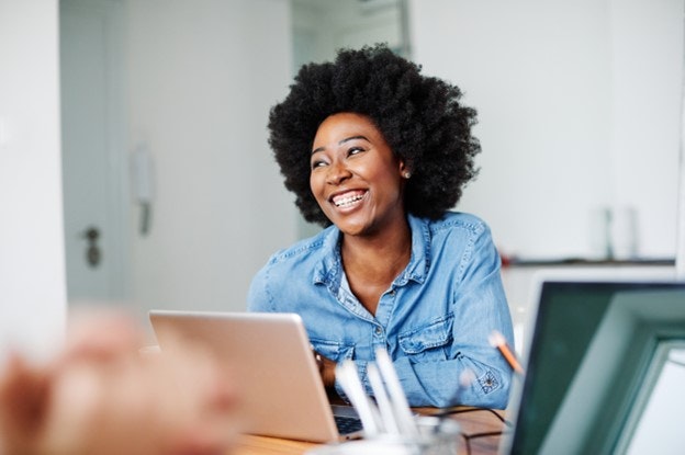 A woman smiling in an office setting