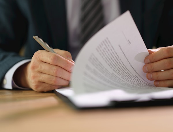 Someone signing an employment contract.