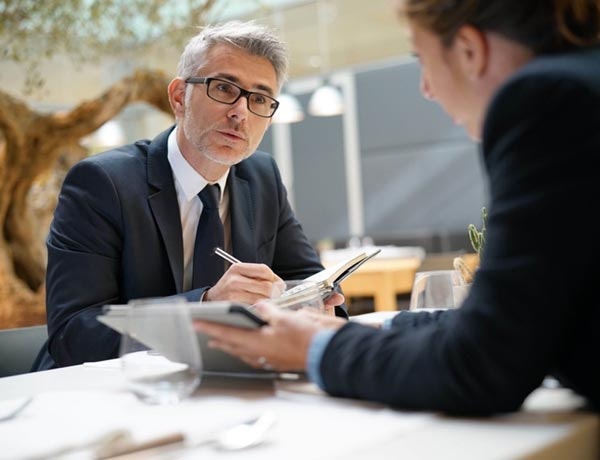 A man and a woman having a business meeting.