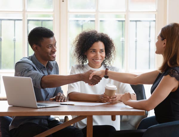 Three people are having a meeting.