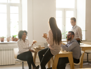 staff members sat together around a table