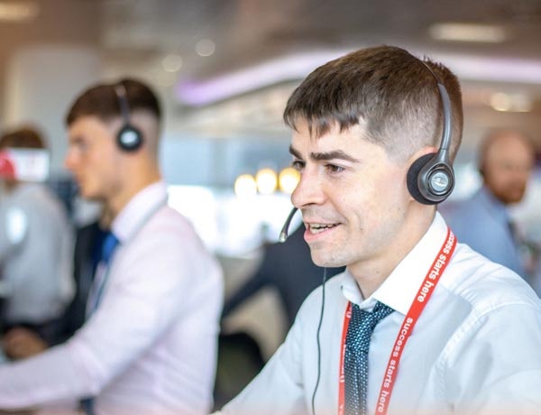 An adviser wearing a headset.