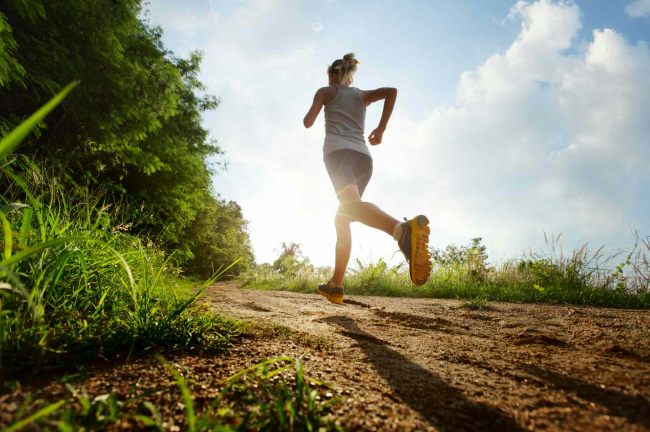 a woman running in the countryside