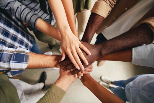 hands in frame belonging to people of all ethnicities