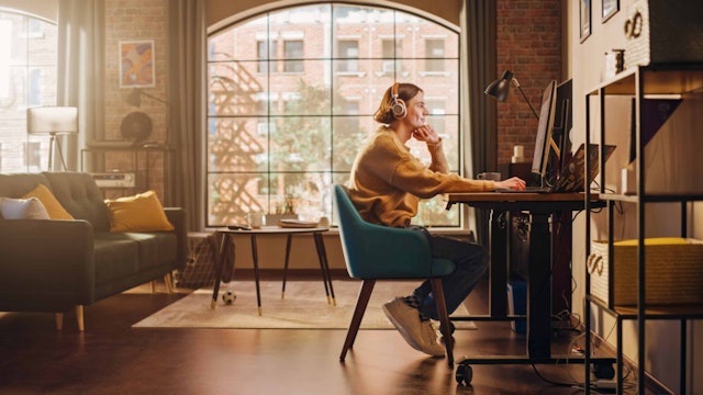 A woman at a desk working from home