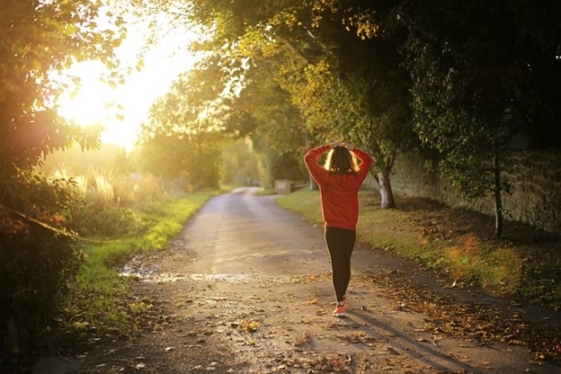 a woman running in the countryside