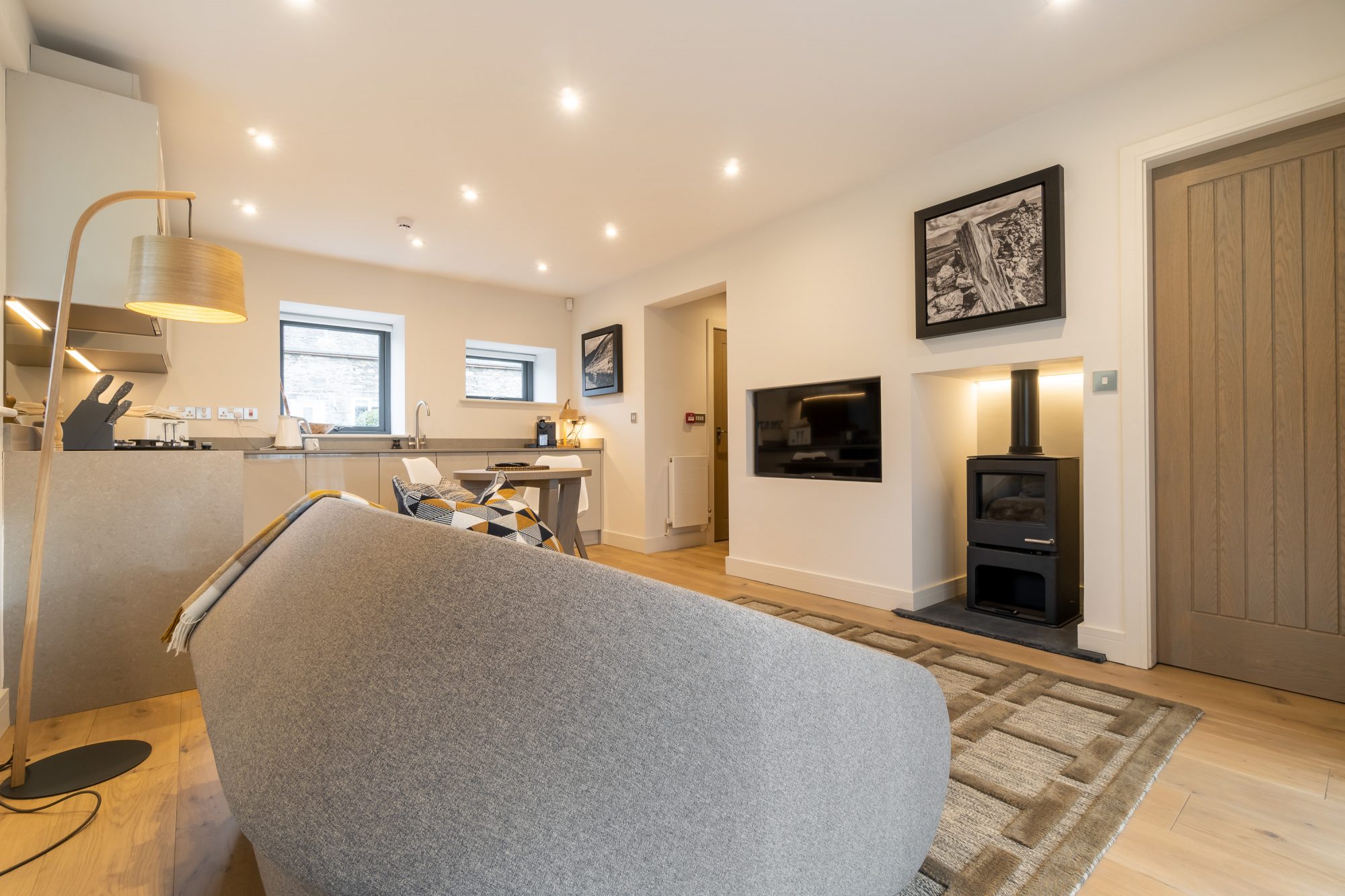Kitchen and living room with a fireplace