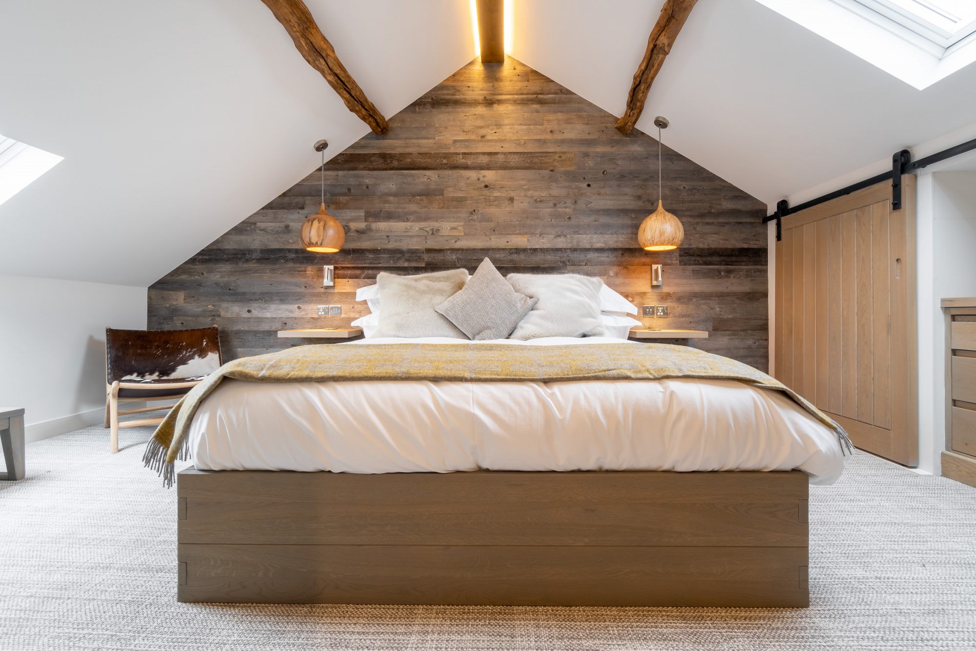 Bedroom with sloped ceiling.