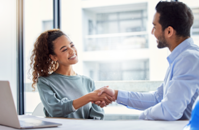 man and woman shaking hands
