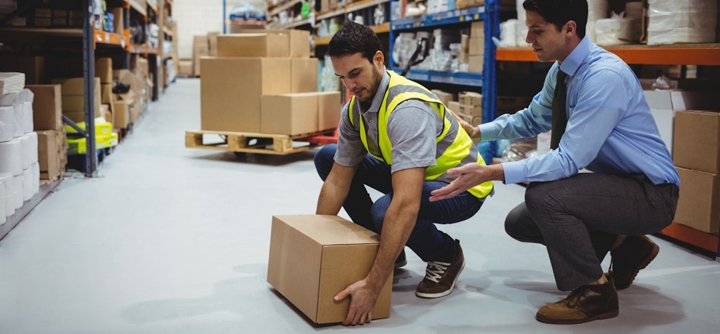 Someone lifting a box.