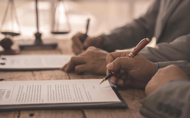 a person signing a contract