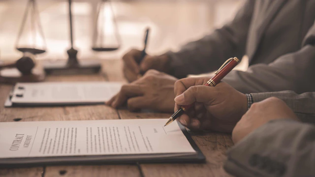 a person signing a contract