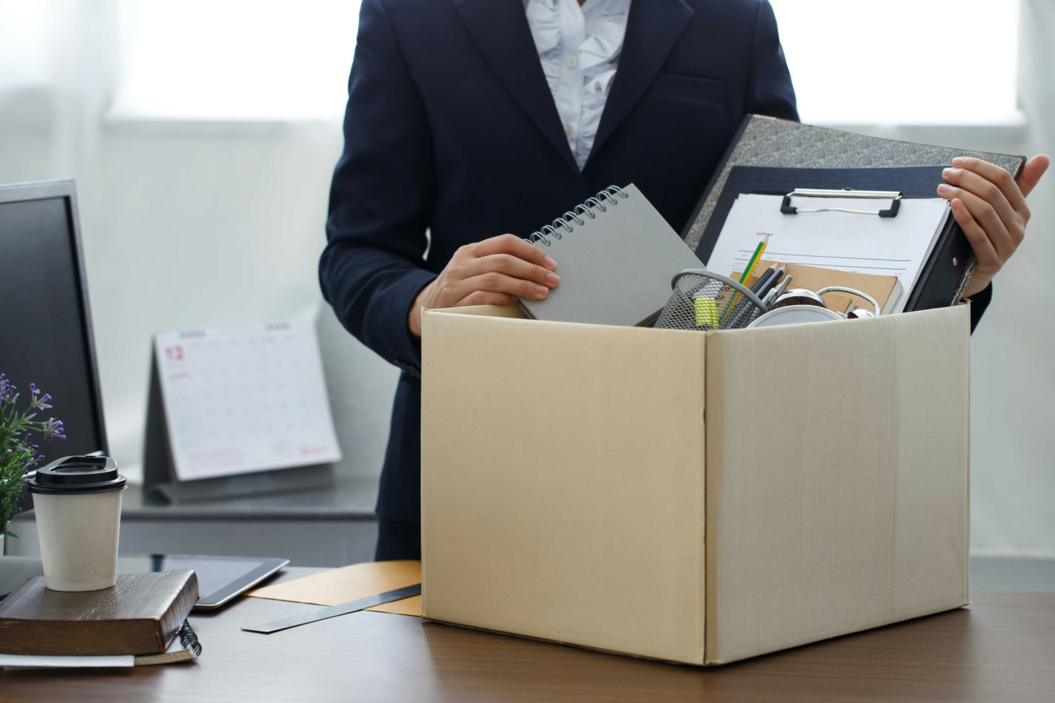 a woman packing a box at work