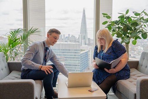 two people looking at laptop screen