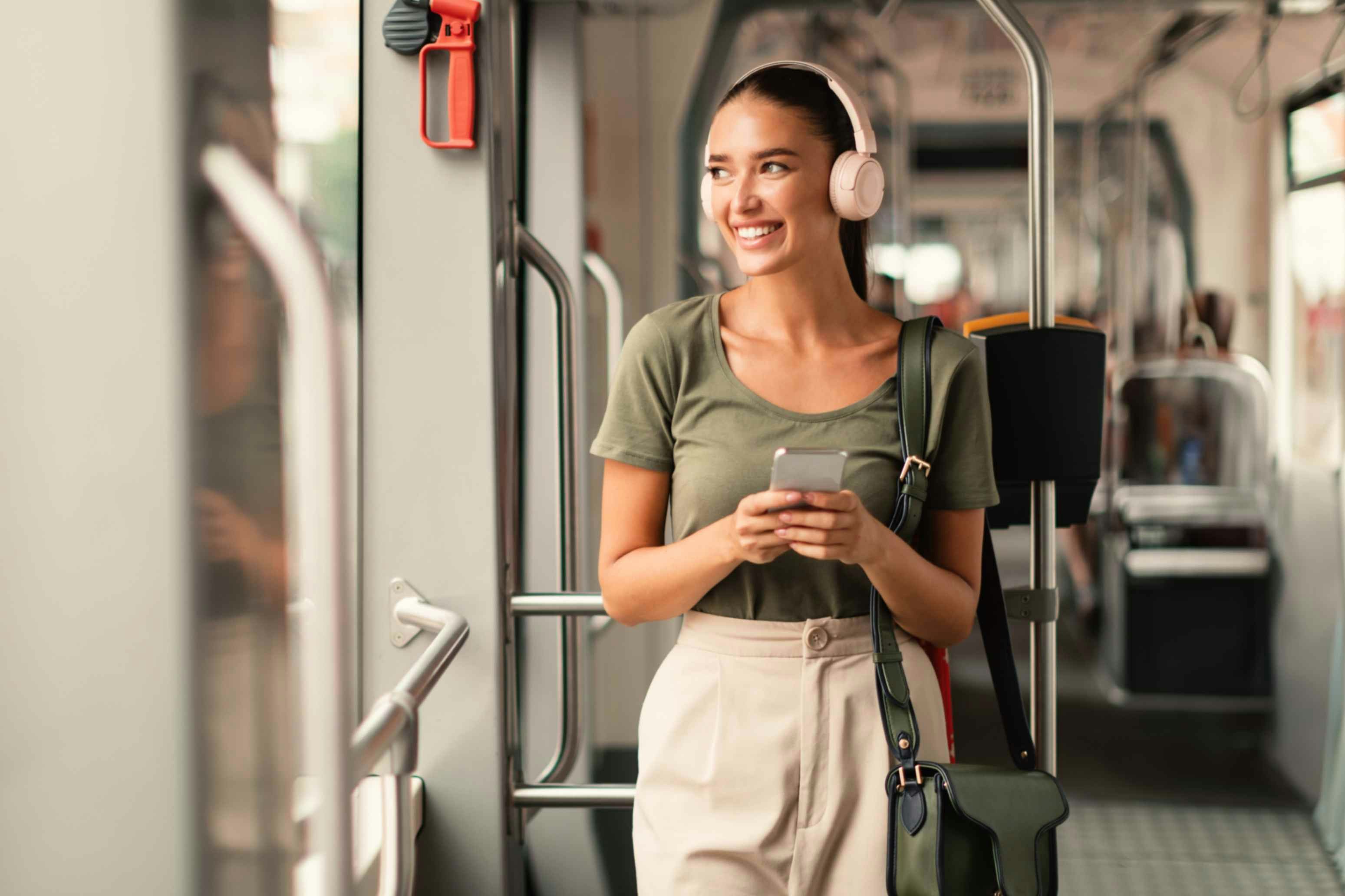 a woman smiling on public transport