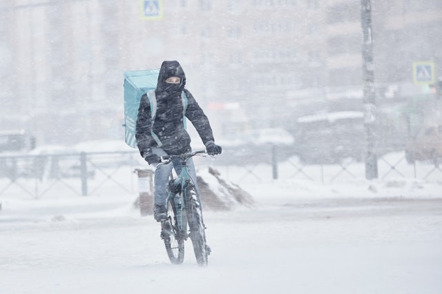 Someone cycling in the snow