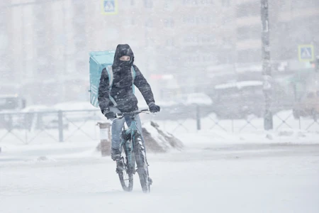 Someone cycling in the snow