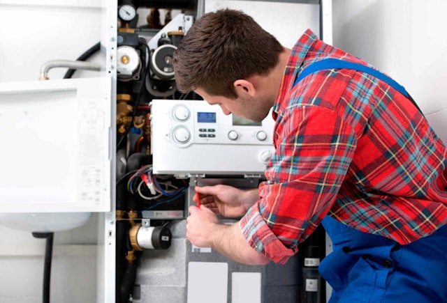 a man assessing a boiler