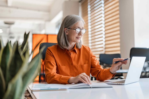 a woman sat at a desk and computer