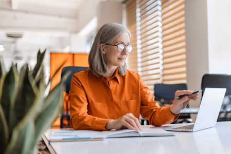 a woman sat at a desk and computer