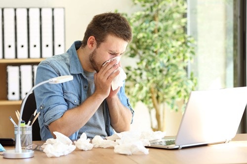 a man blowing his nose