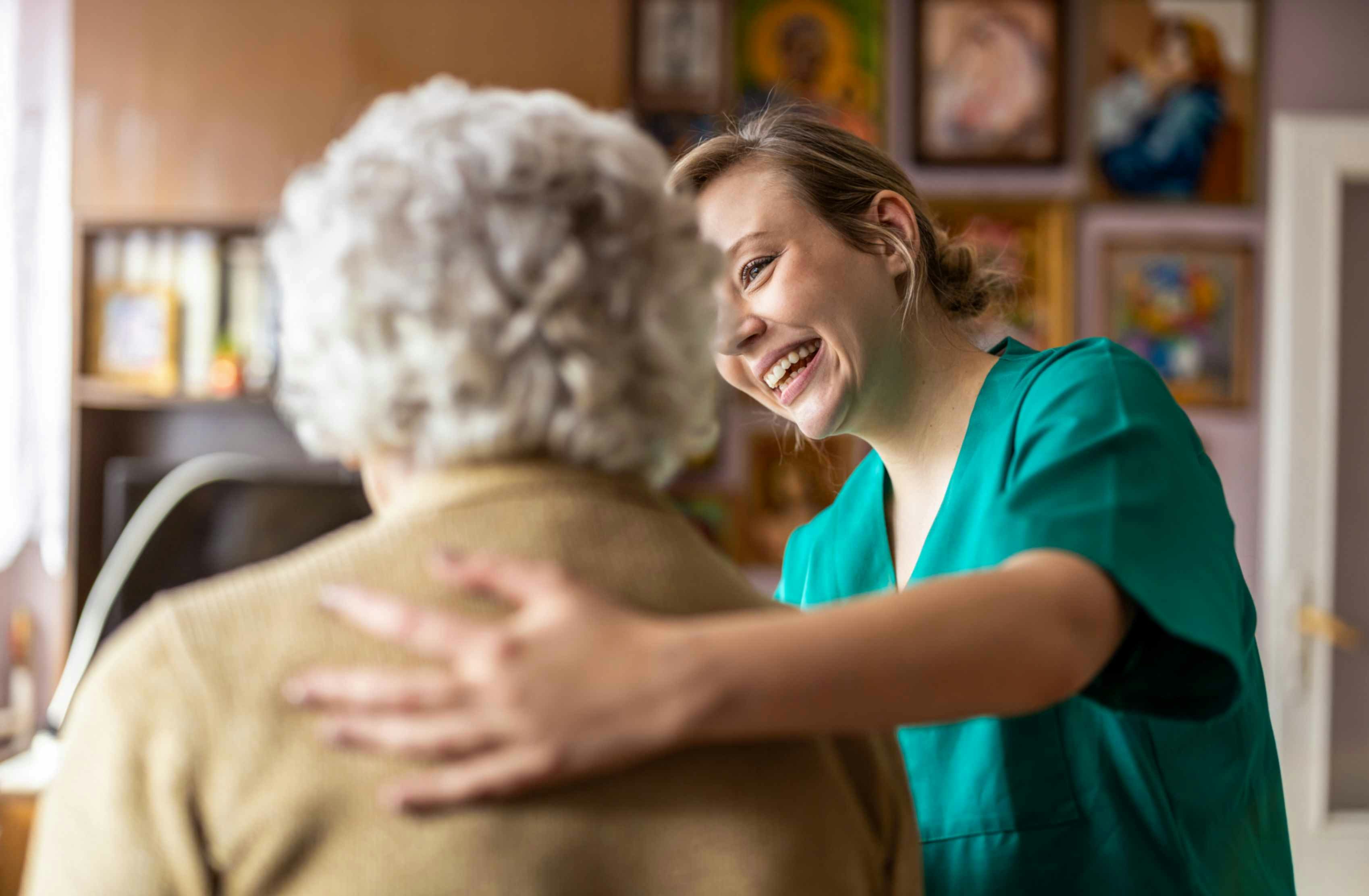 a nurse helping an elderly woman