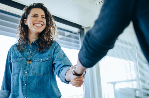 woman shaking hands with someone