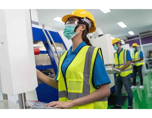 a woman in PPE working