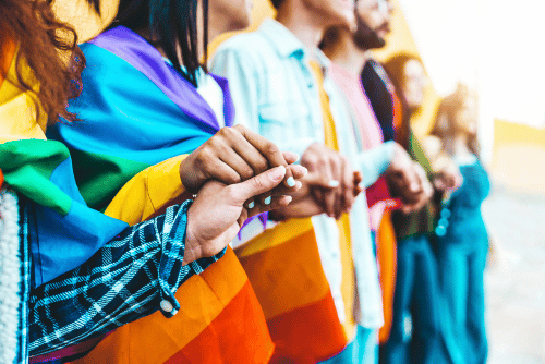 members of the LGBTQ2+ community holding hands