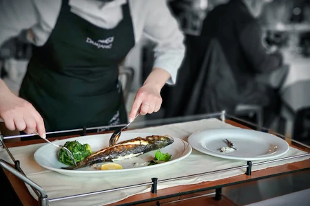 Someone cooking fish.