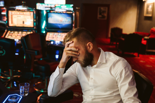 man with gambling addiction in casino
