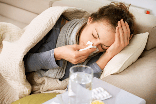 woman with flu on the couch