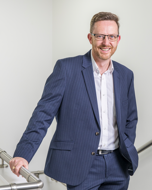 A professional man wearing a suit.