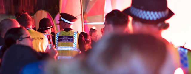police officers and rioters stood together