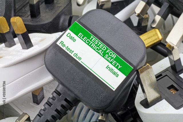 A PAT sticker on a plug