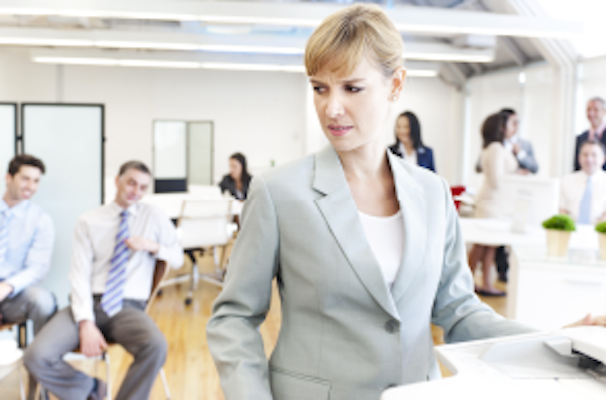 woman in suit being stared at by other men in suits