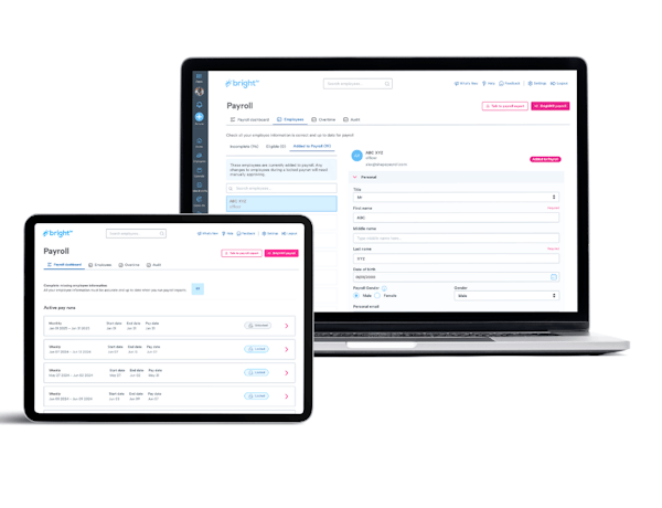 A laptop and tablet displaying payroll software