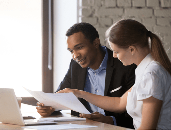HR Management Software - An employer using Peninsula's HR Management Software with their staff.